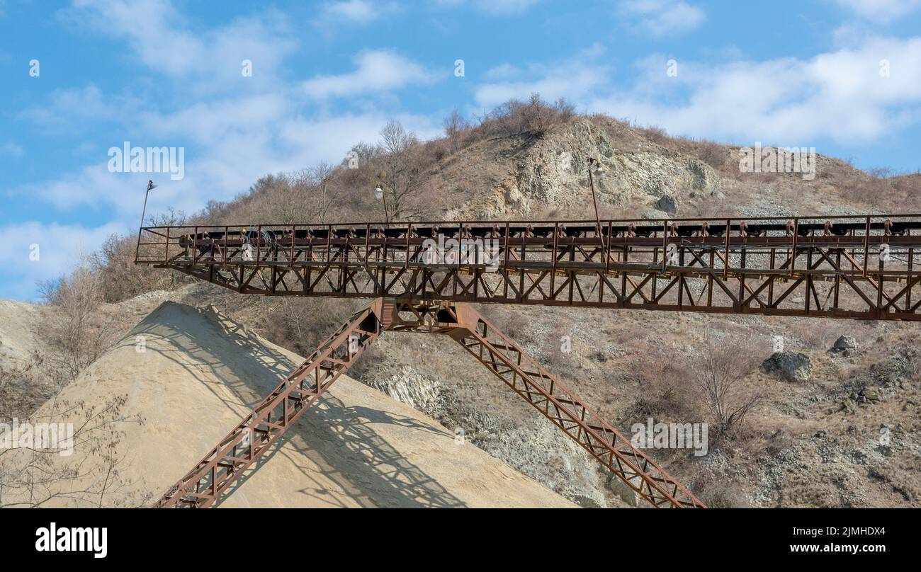Conveyor belt at an old gravel quarry. Mining and quarrying equipment