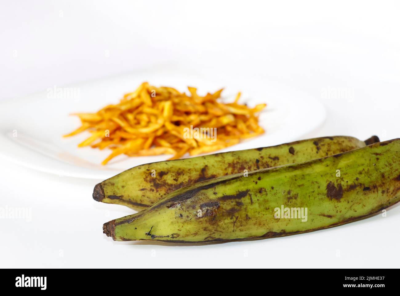 Closeup Image Of Plantain Banana And Chips In White Background Stock Photo