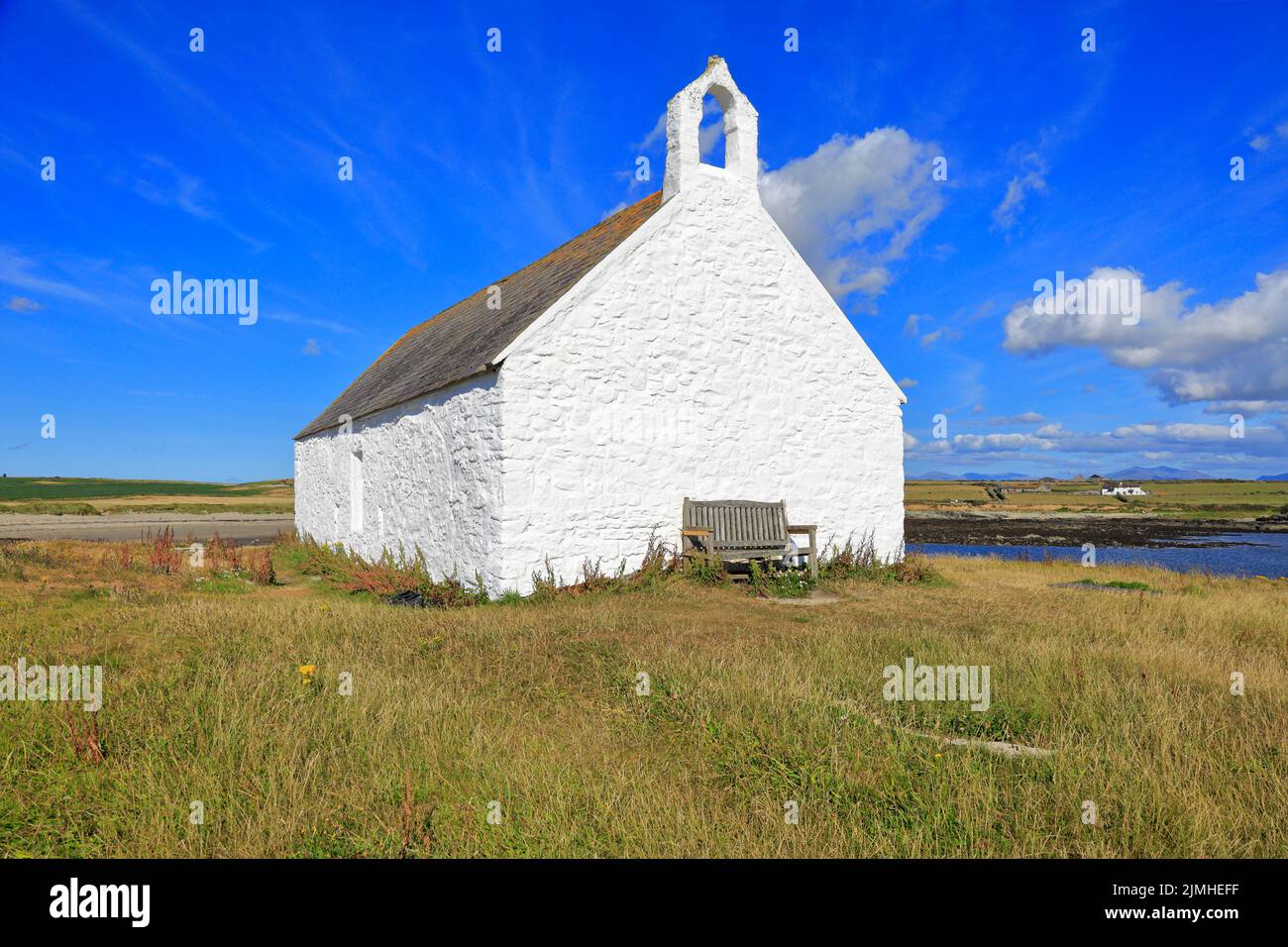 St Cwyfan's Church in Porth Cwyfan at low tide, Aberffraw, Isle of Anglesey, Ynys Mon, North Wales, UK. Stock Photo
