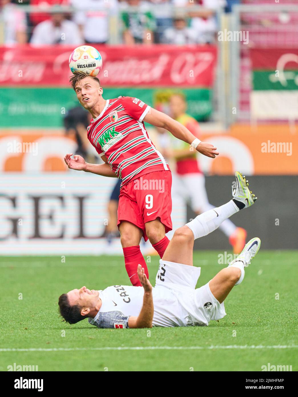Ermedin Demirovic, FCA 9  compete for the ball, tackling, duel, header, zweikampf, action, fight against Michael Gregoritsch, FRG 38  in the match FC AUGSBURG - SC FREIBURG 0-4 1.German Football League on Aug 06, 2022 in Augsburg, Germany. Season 2022/2023, matchday 1, 1.Bundesliga, FCB, Munich, 1.Spieltag © Peter Schatz / Alamy Live News    - DFL REGULATIONS PROHIBIT ANY USE OF PHOTOGRAPHS as IMAGE SEQUENCES and/or QUASI-VIDEO - Stock Photo