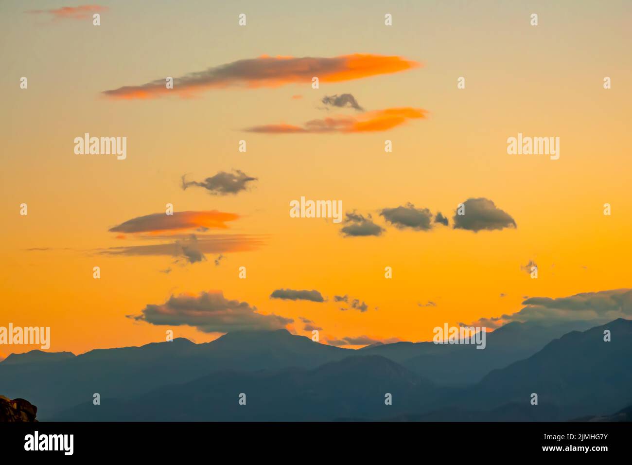 Mountain Silhouettes and Golden Sunset Sky Stock Photo - Alamy