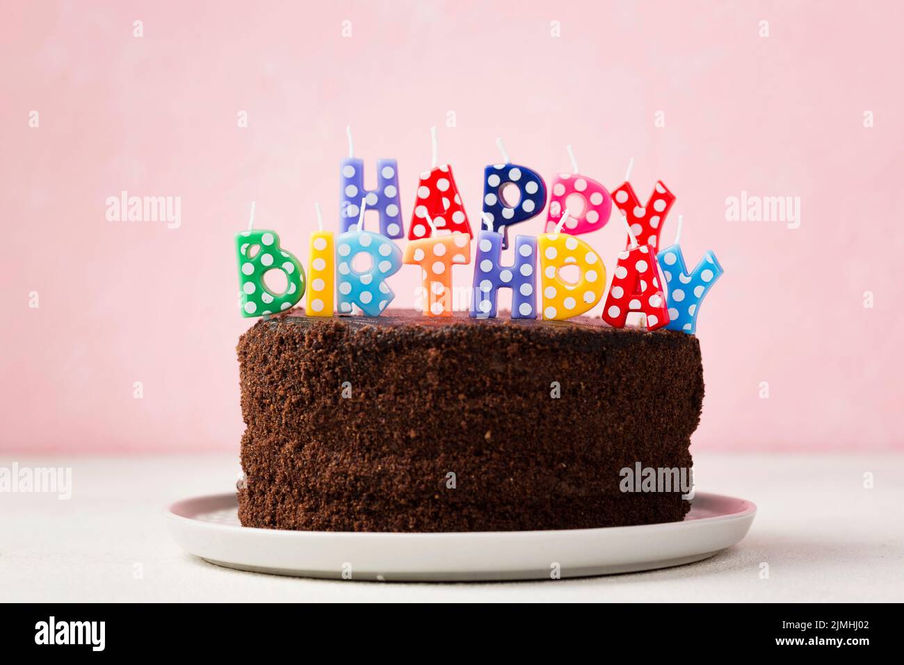 Birthday concept with chocolate cake cute candles Stock Photo - Alamy