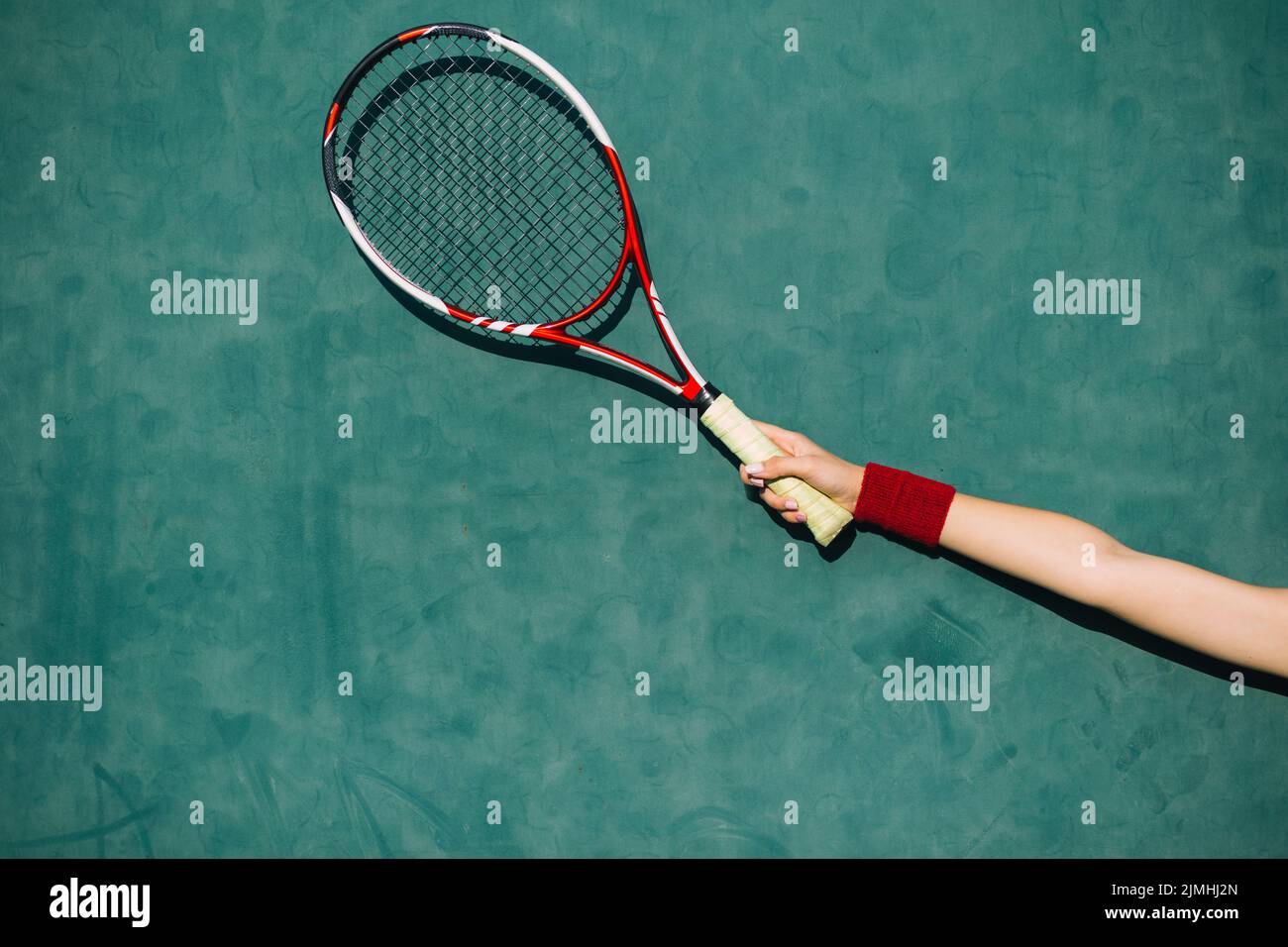Woman holding tennis racket hand Stock Photo Alamy