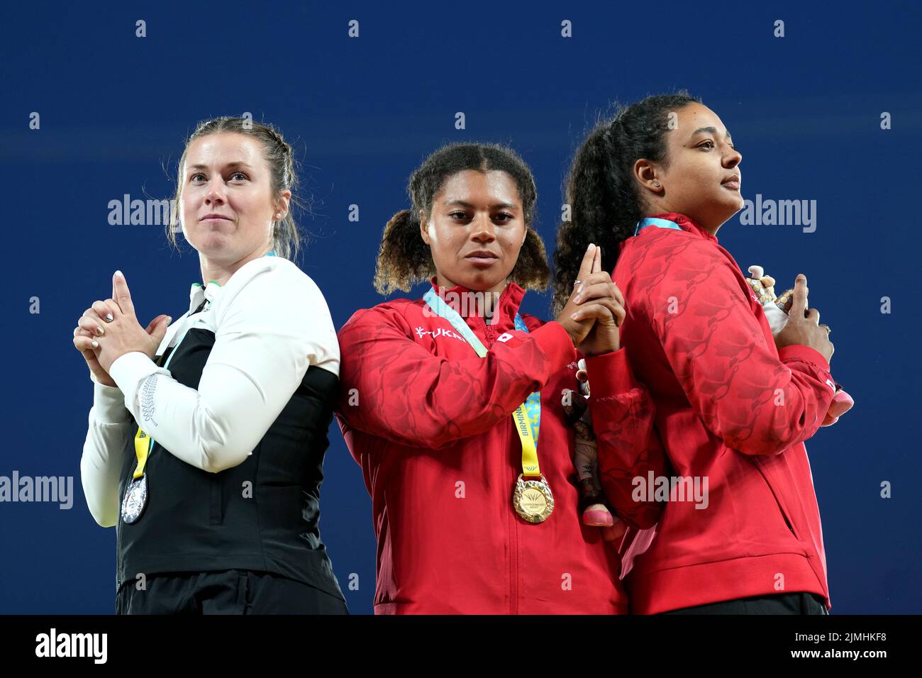 Canada's Camryn Rogers (centre) with the gold medal, New Zealand's