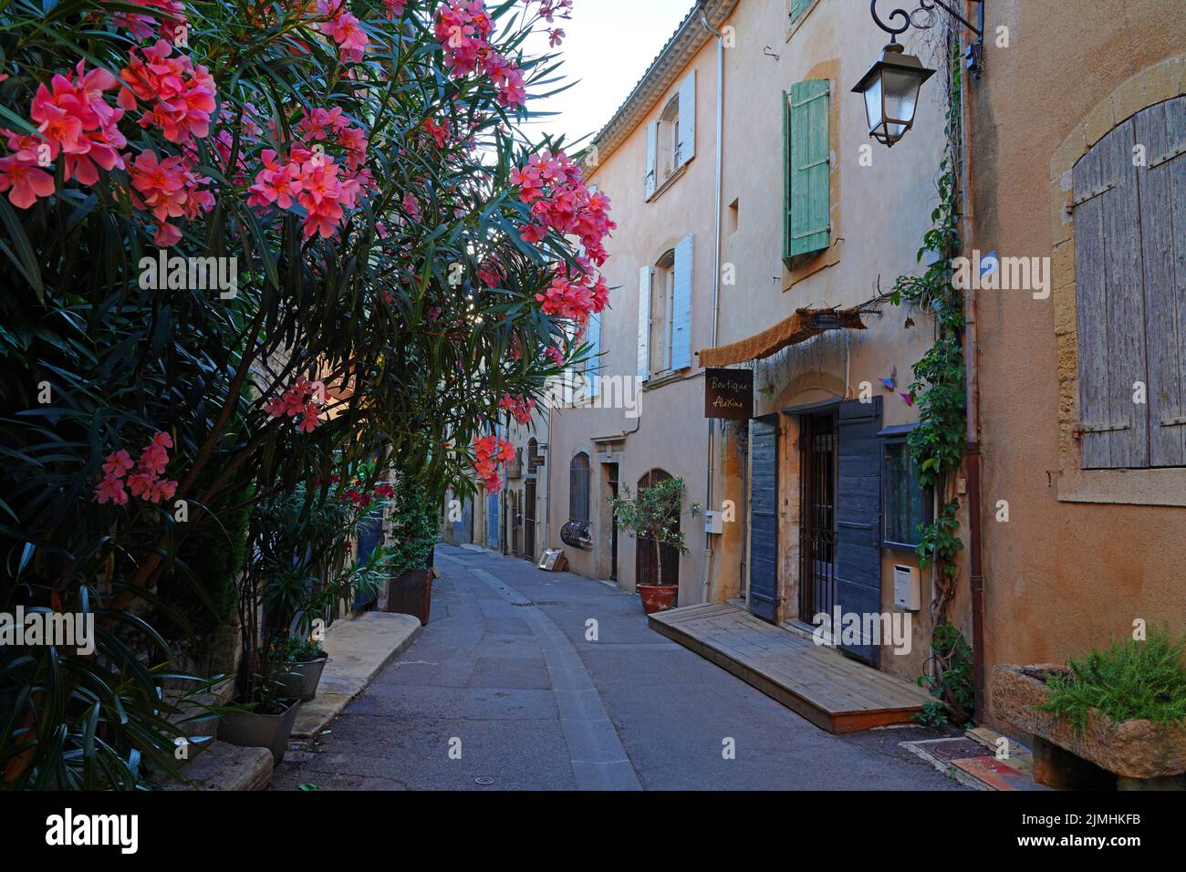 LOURMARIN, FRANCE -5 JUL 2021- View of traditional buildings in Lourmarin, a town in the Luberon area of Vaucluse, Provence, France, named as one of t Stock Photo