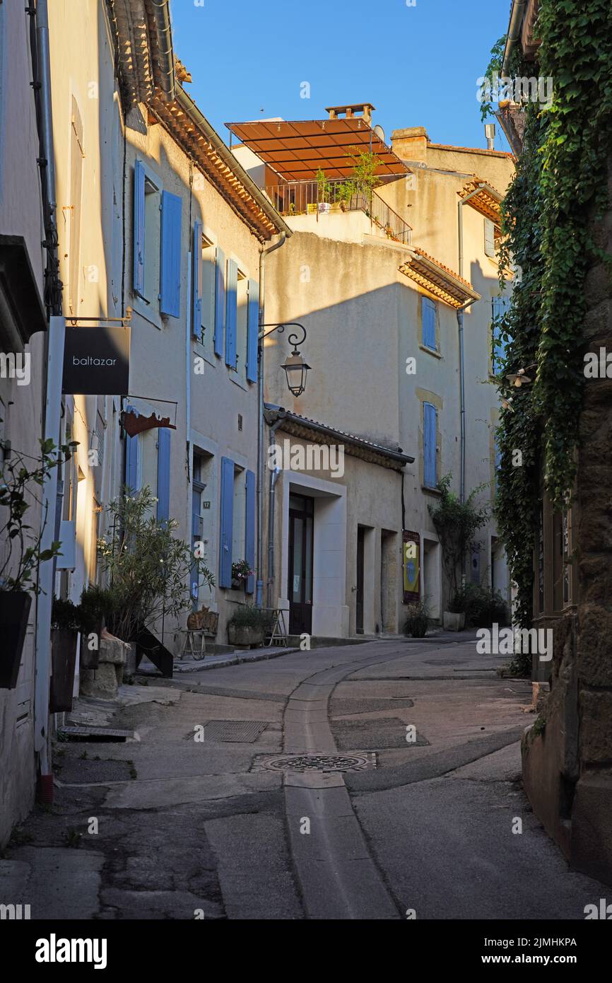 LOURMARIN, FRANCE -5 JUL 2021- View of traditional buildings in Lourmarin, a town in the Luberon area of Vaucluse, Provence, France, named as one of t Stock Photo