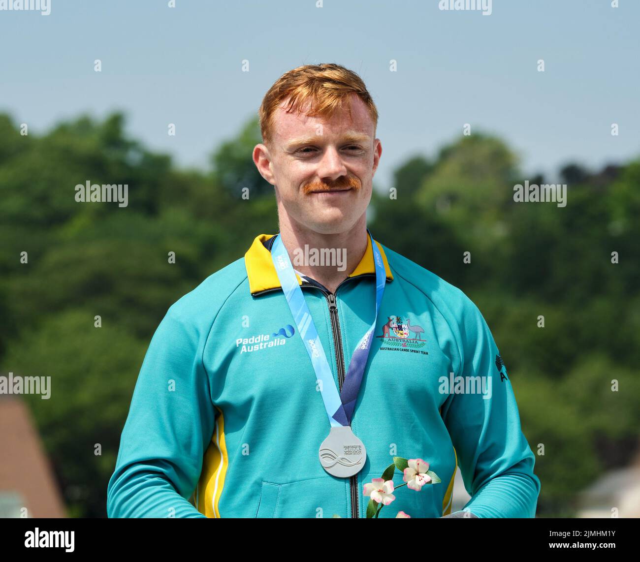 Dartmouth, Canada. August 6th, 2022. Silver Medalist Jean Westhuyzen from Australia on the podium receiving his medal in the K1 Men 500m event. The 2022 ICF Canoe Sprint and Paracanoe World Championships takes place on Lake Banook in Dartmouth (Halifax). Credit: meanderingemu/Alamy Live News Stock Photo