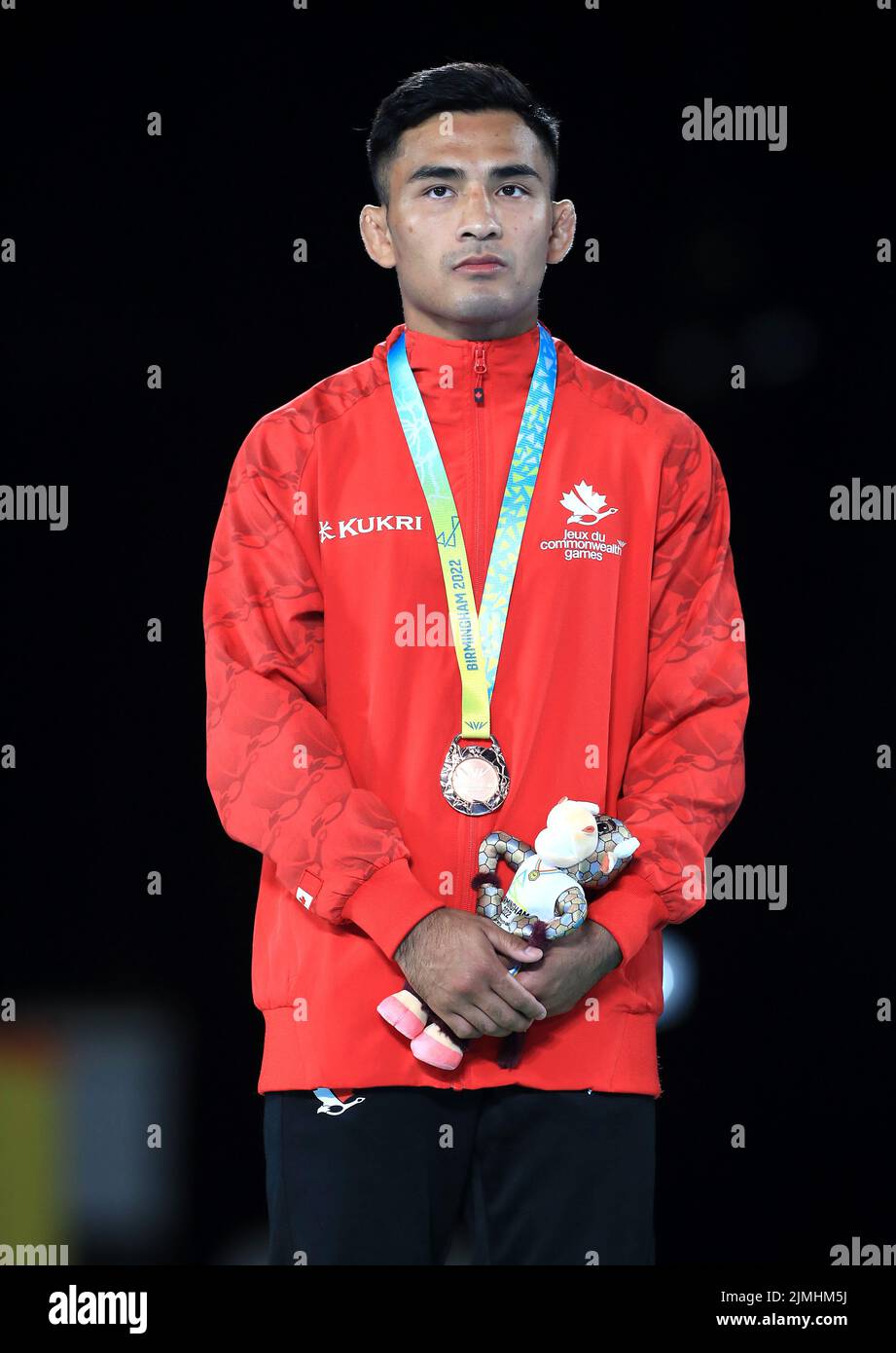 Canada's Darthe Capellan with the silver medal in the Men's Freestyle 57kg at the Coventry Arena on day nine of the 2022 Commonwealth Games. Picture date: Saturday August 6, 2022. Stock Photo
