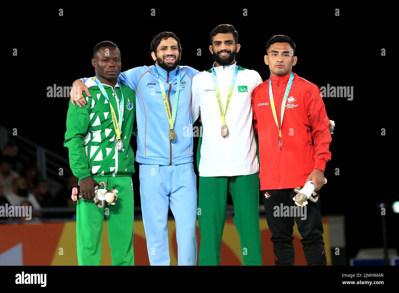 India's Kumar Ravi (left) with the gold medal in the Men's Freestyle 57kg with Nigeria's Ebikewenimo Welson (left) with silver and Pakistan's Ali Asad and Canada's Darthe Capellan with the bronze at the Coventry Arena on day nine of the 2022 Commonwealth Games. Picture date: Saturday August 6, 2022. Stock Photo