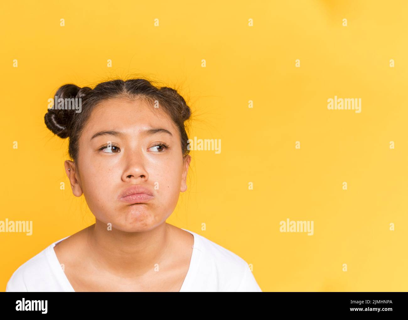 Sad asian woman with tied hair copy space Stock Photo