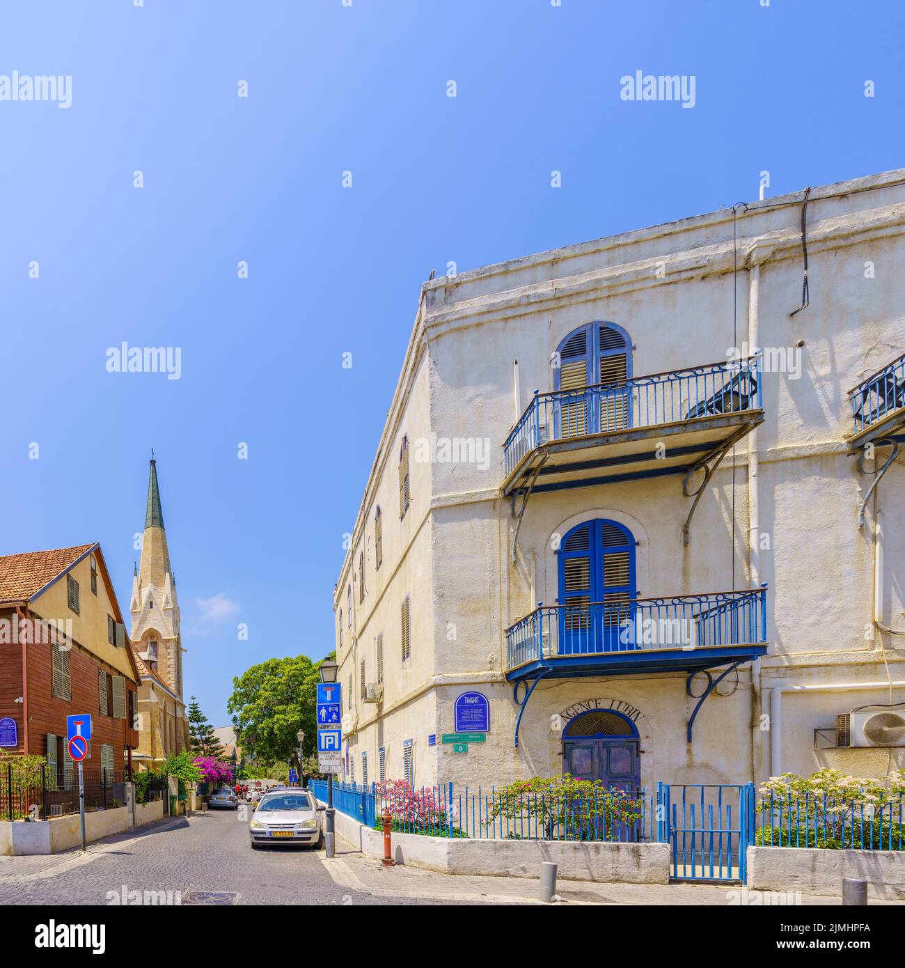 Tel-Aviv, Israel - May 26, 2022: View of the historic Immanuel building and Immanuel Church, with locals and visitors, in Jaffa, now part of Tel-Aviv- Stock Photo