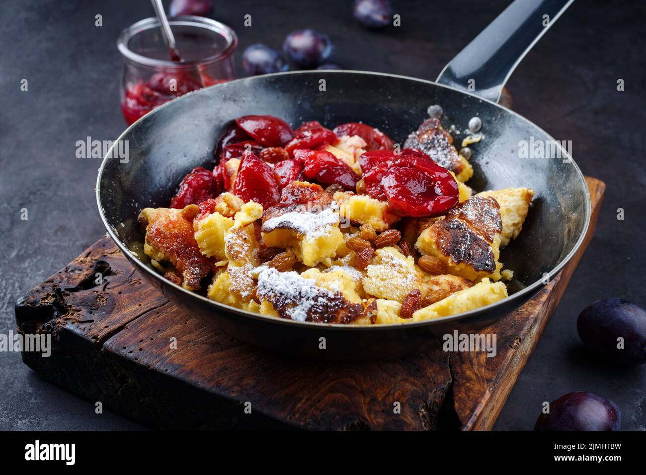 Traditional Austrian Kaiserschmarren with plums and raisins served as a ...