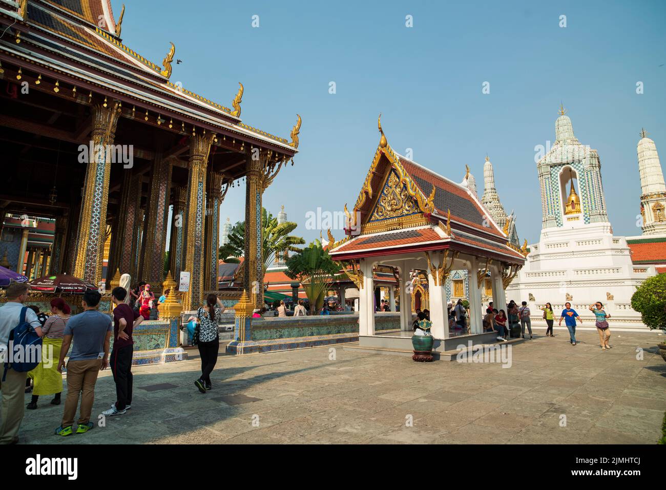 Famous Royal grand palace in Bangkok. Tourists visiting the temple. Stock Photo