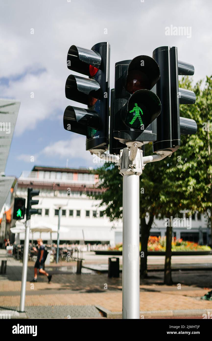 A traffic light with a green pedestrian light Stock Photo - Alamy