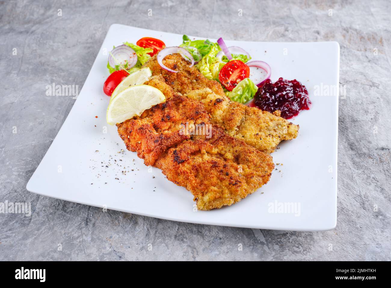 Traditional deepfried schnitzel with green salad Stock Photo Alamy