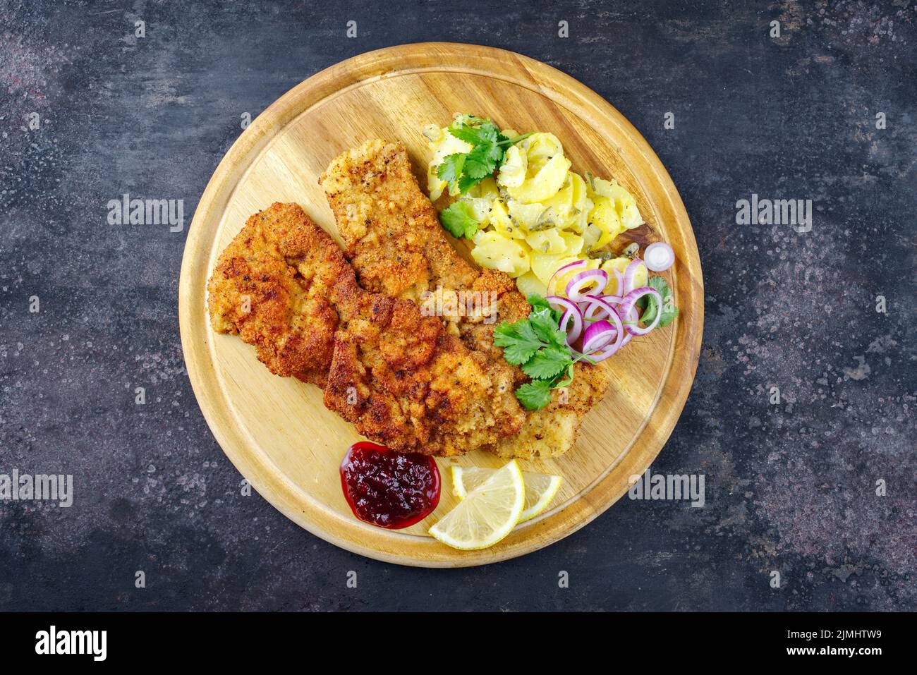 Traditional deepfried schnitzel with potato salad Stock Photo Alamy