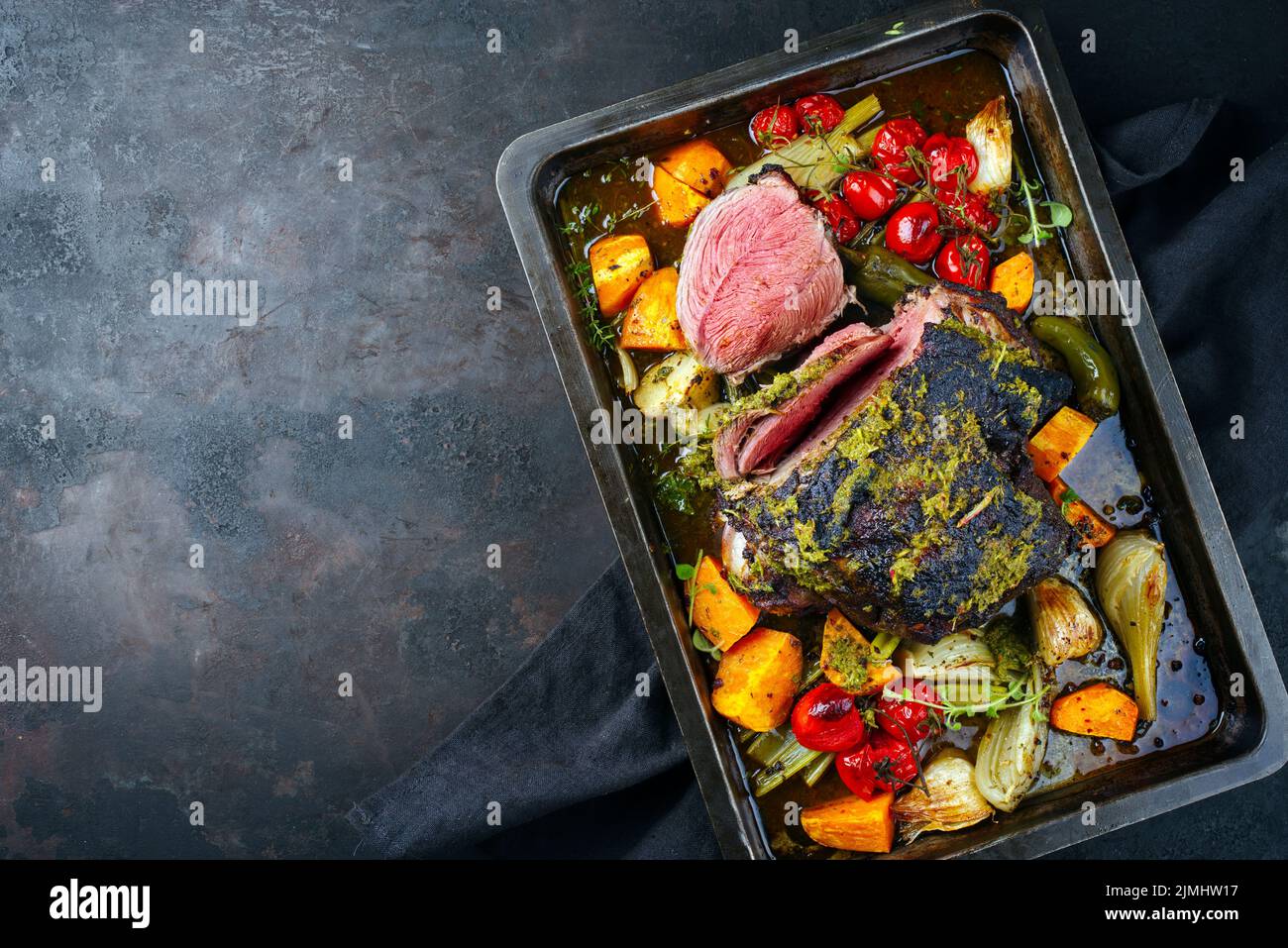 Traditional English barbecue lamb roast with mint leaf and vegetable