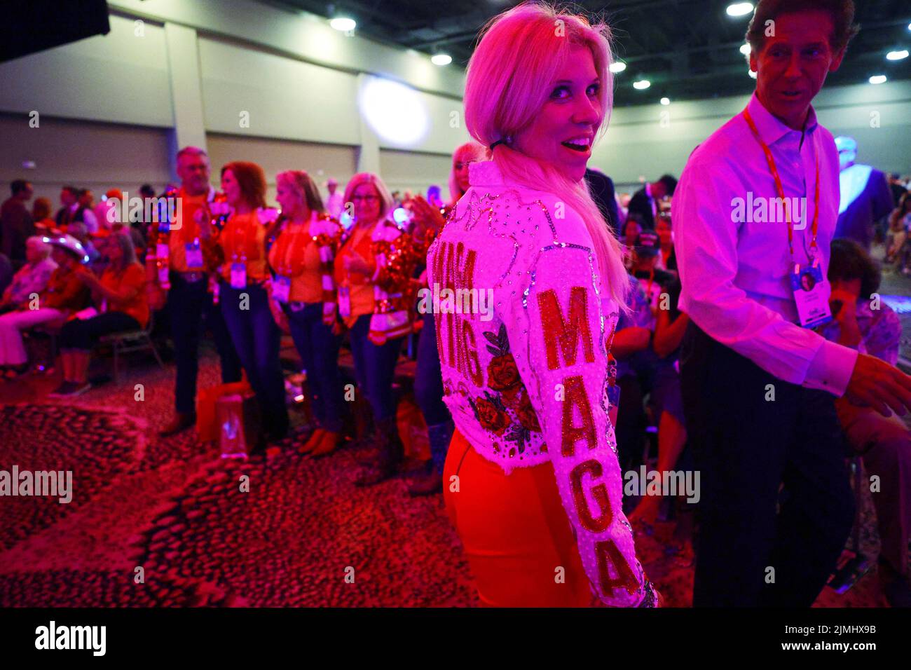 A woman wears a 'MAGA King' jacket at the Conservative Political Action Conference (CPAC) in Dallas, Texas, U.S., August 6, 2022.  REUTERS/Brian Snyder Stock Photo