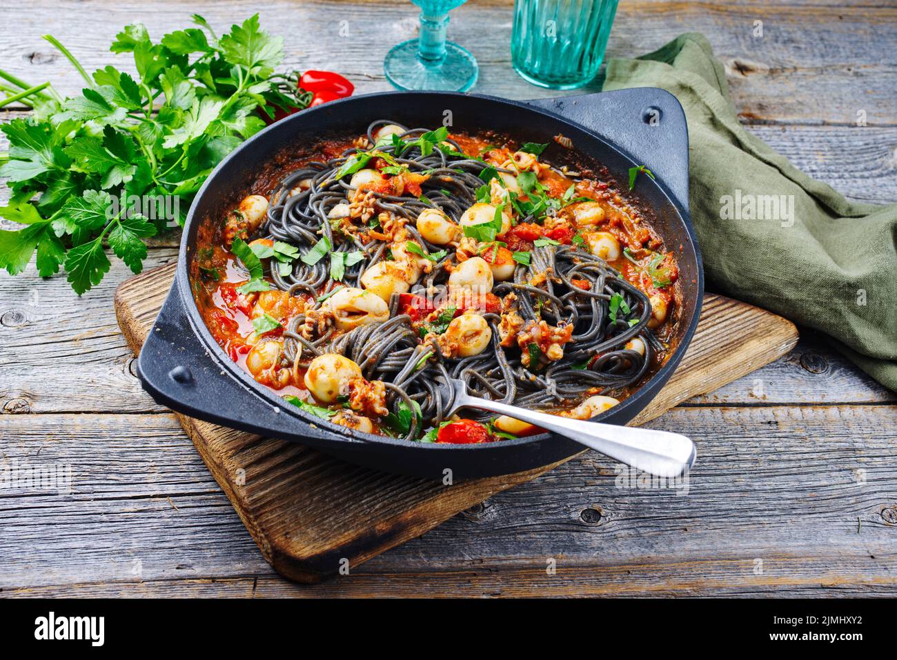 Traditional Italian spaghetti al nero di seppia with baby squid ink in