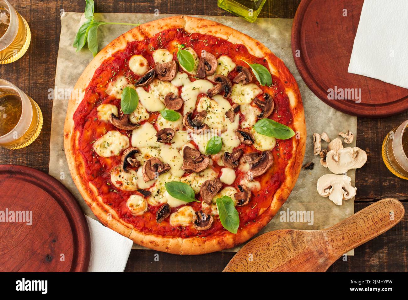 Grilled margherita pizza with tomato sauce cheese basil mushroom Stock