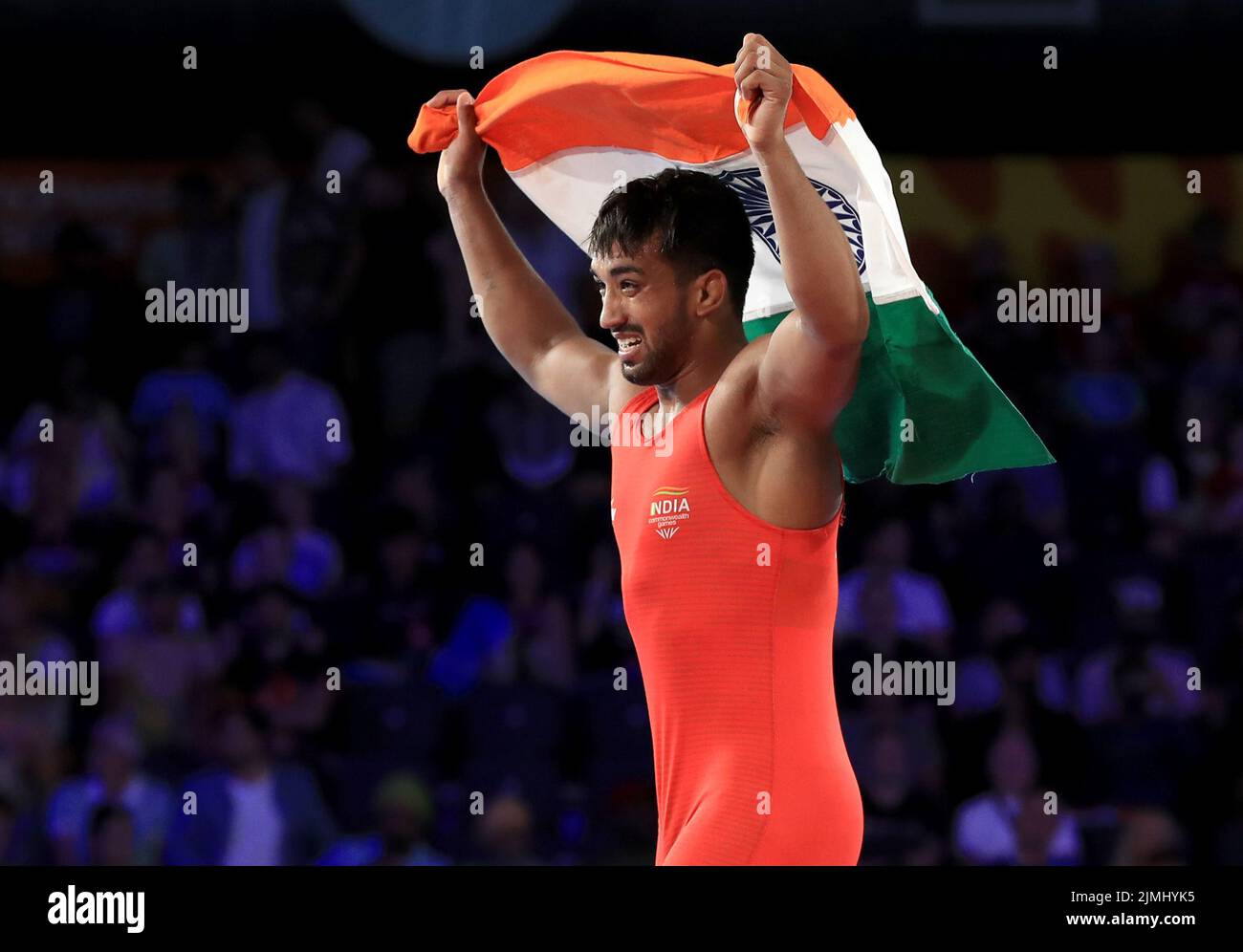 India’s Naveen Naveen celebrates winning against s against Pakistan’s Muhammad Sharif Tahir in the Men’s 74kg Gold Medal match at the Coventry Arena on day nine of the 2022 Commonwealth Games. Picture date: Saturday August 6, 2022. Stock Photo