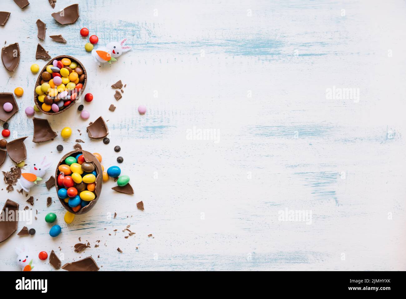 Cute bunnies near easter sweets Stock Photo