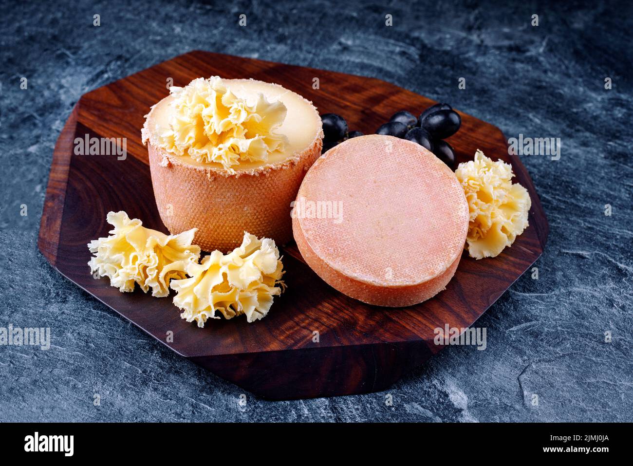 Traditional tete de moine aged mountain cheese of the Alps served with