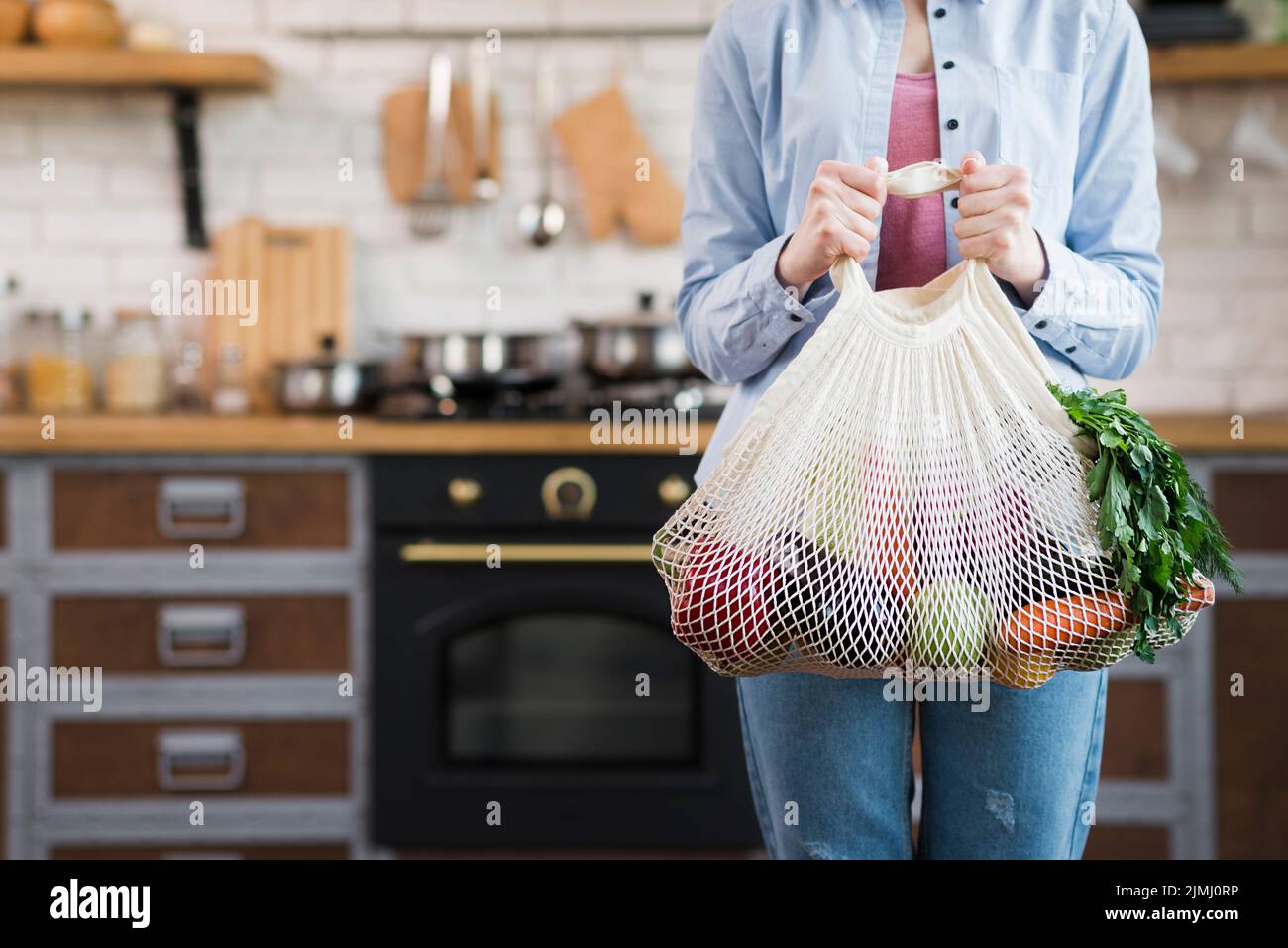 Young woman holding eco bag hi-res stock photography and images - Alamy