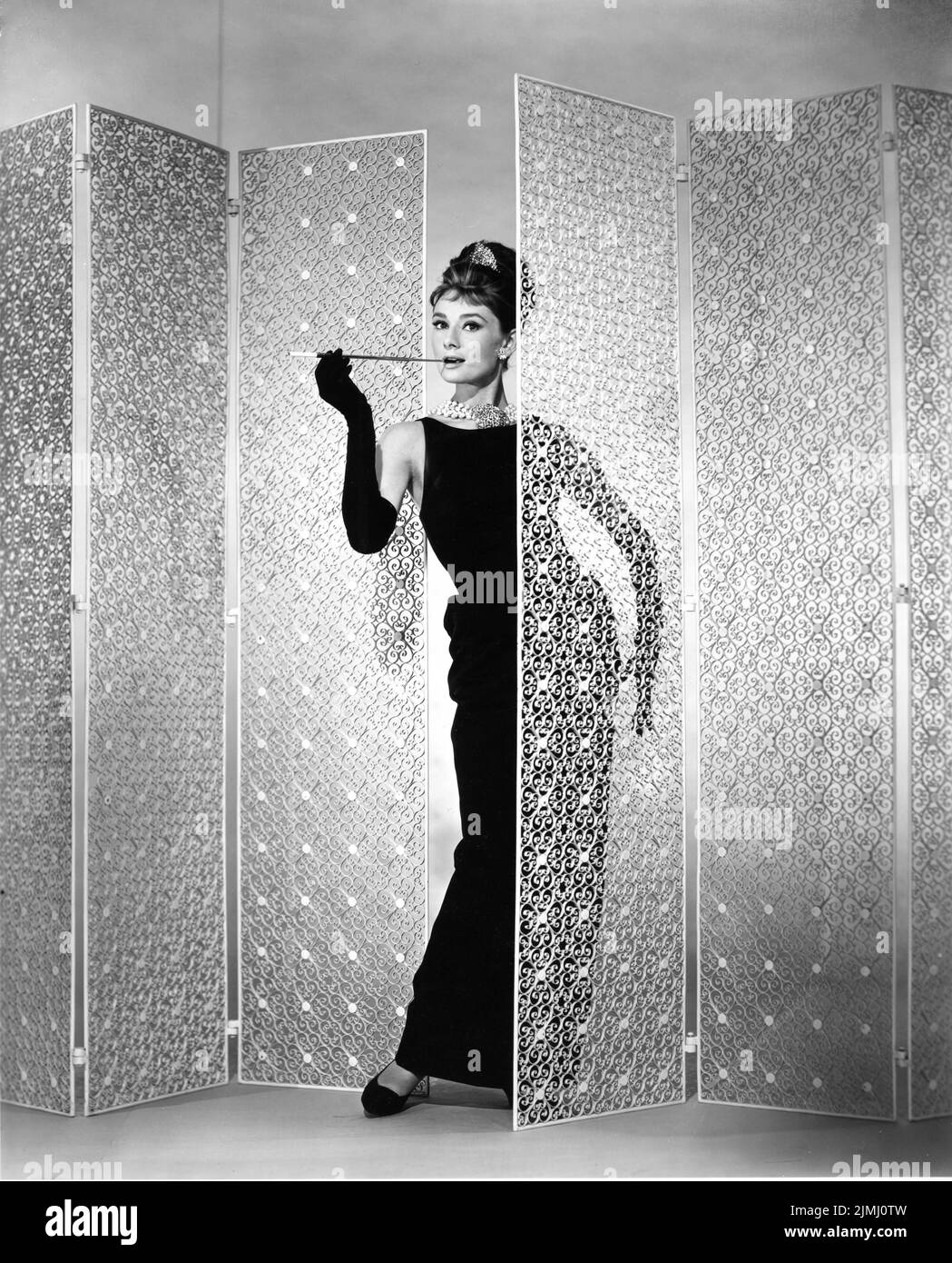AUDREY HEPBURN as Holly Golightly Portrait by BUD FRAKER for BREAKFAST AT TIFFANY'S 1961 director BLAKE EDWARDS novel Truman Capote gown Hubert de Givenchy Jurow-Shepherd / Paramount Pictures Stock Photo
