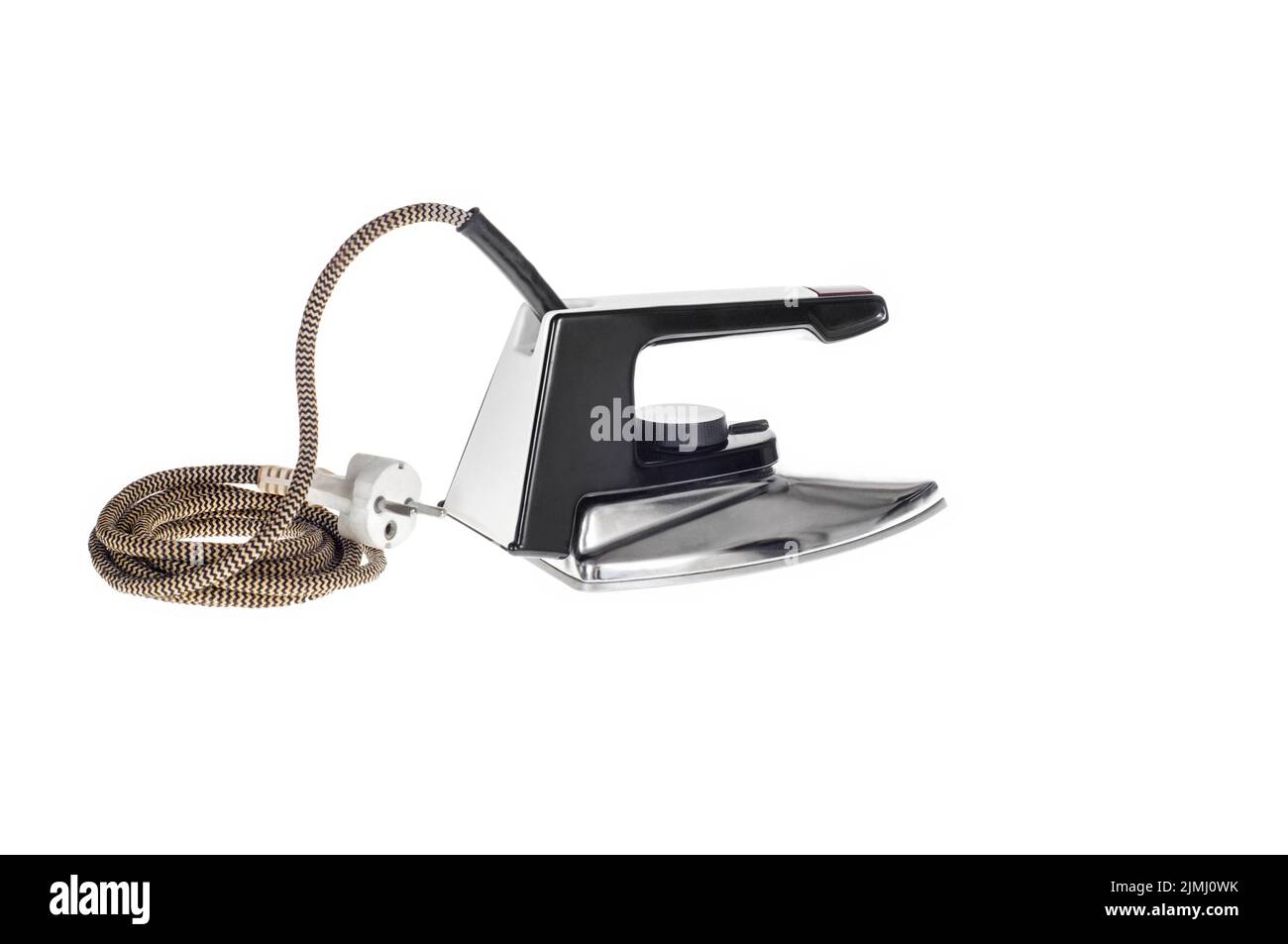An old, classic electric iron for ironing, isolated on a white background with a clipping path Stock Photo