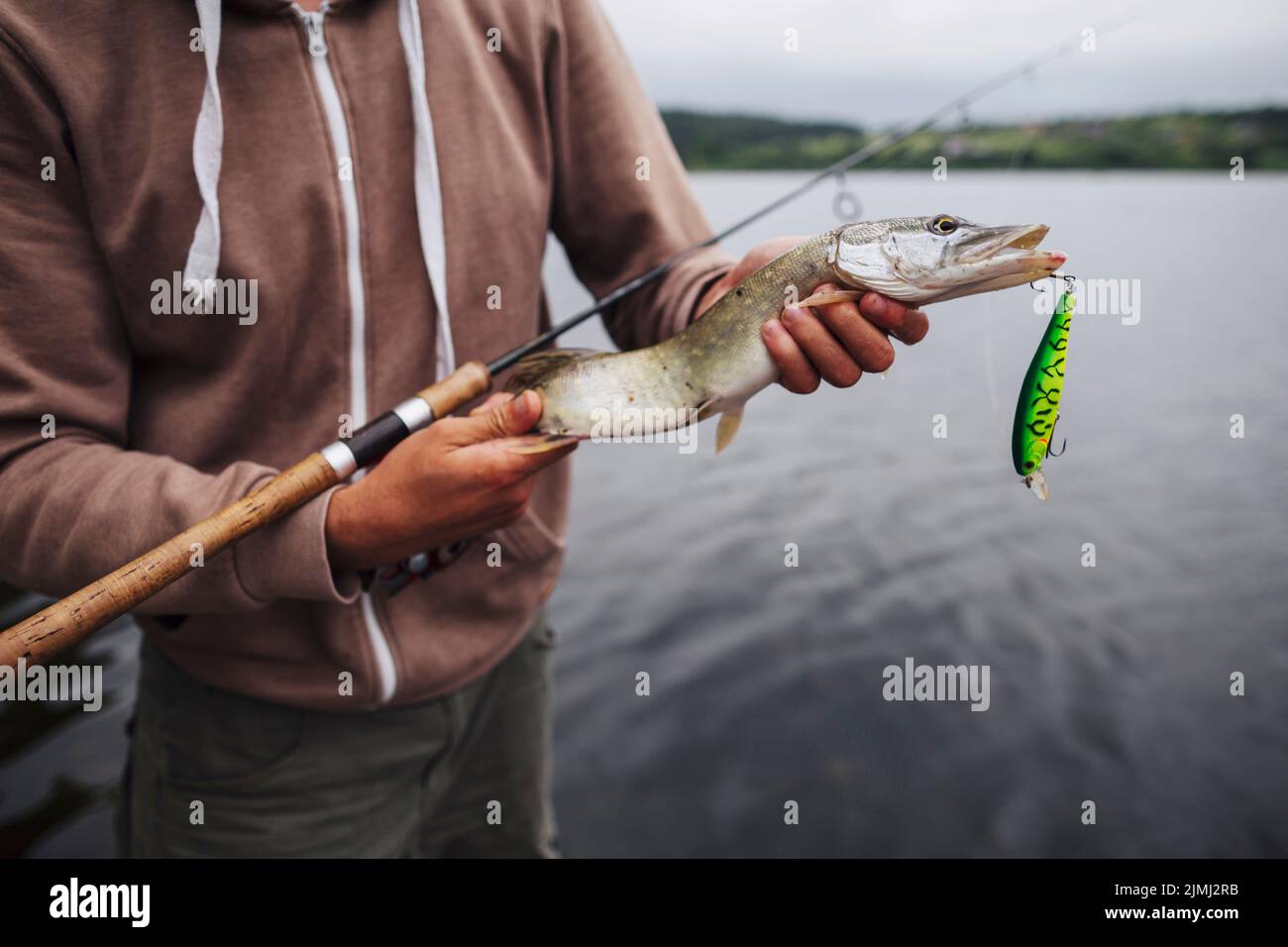 Man holding live fish hi-res stock photography and images - Alamy