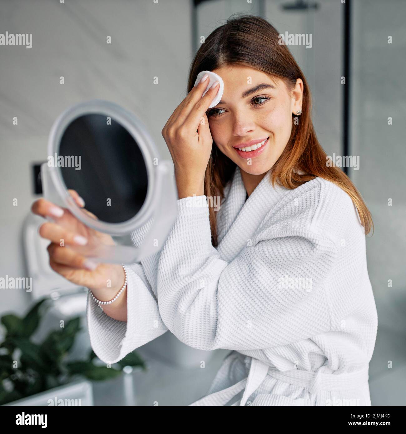 Beautiful woman taking care her face Stock Photo Alamy