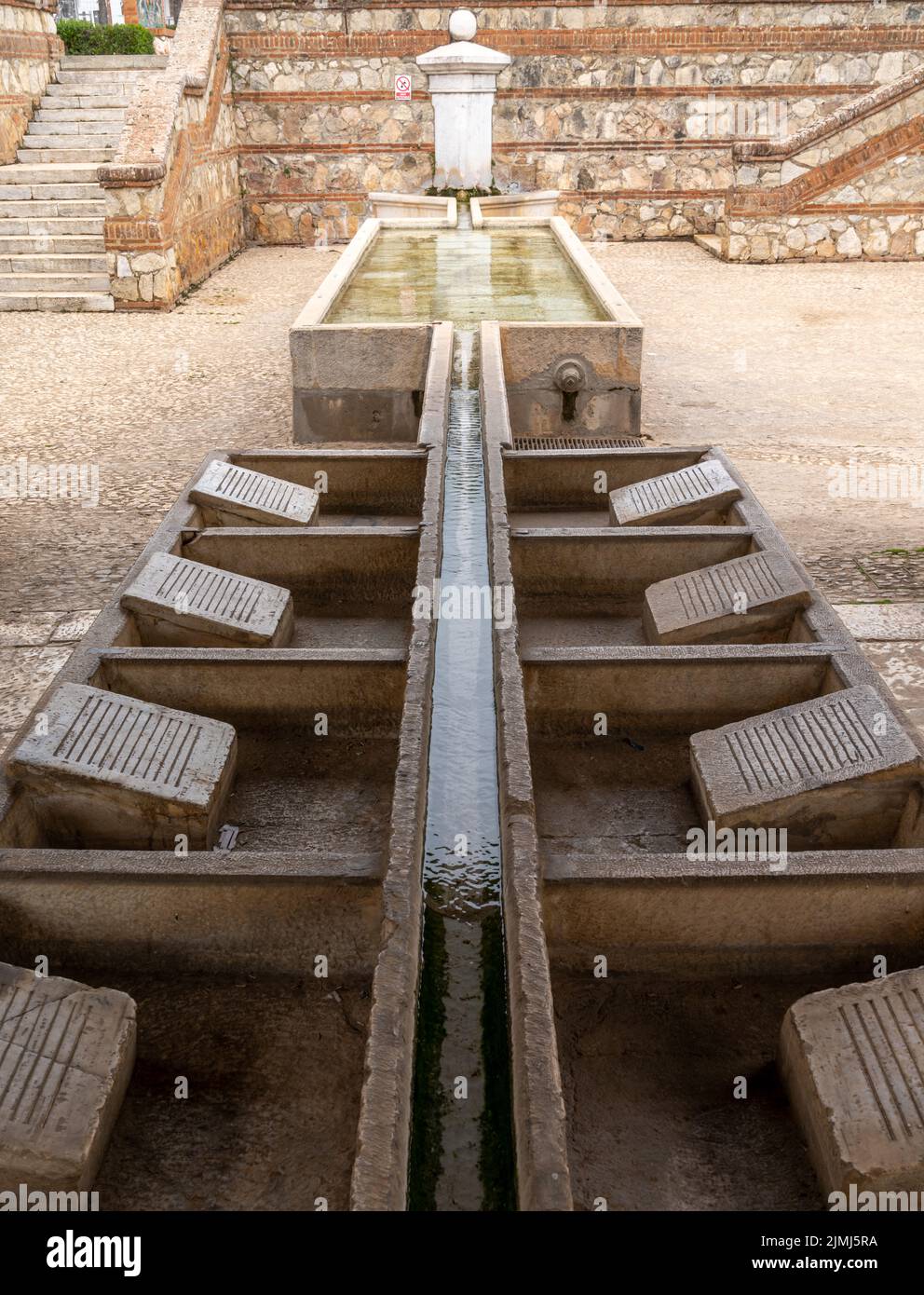 Historic public laundry installation and fountain in the city center of Aracena Stock Photo