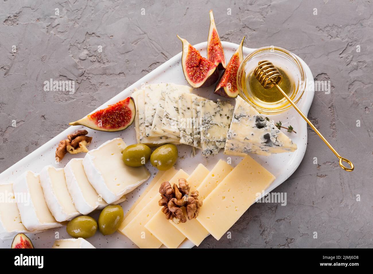 Cheese mix platter with honey Stock Photo Alamy