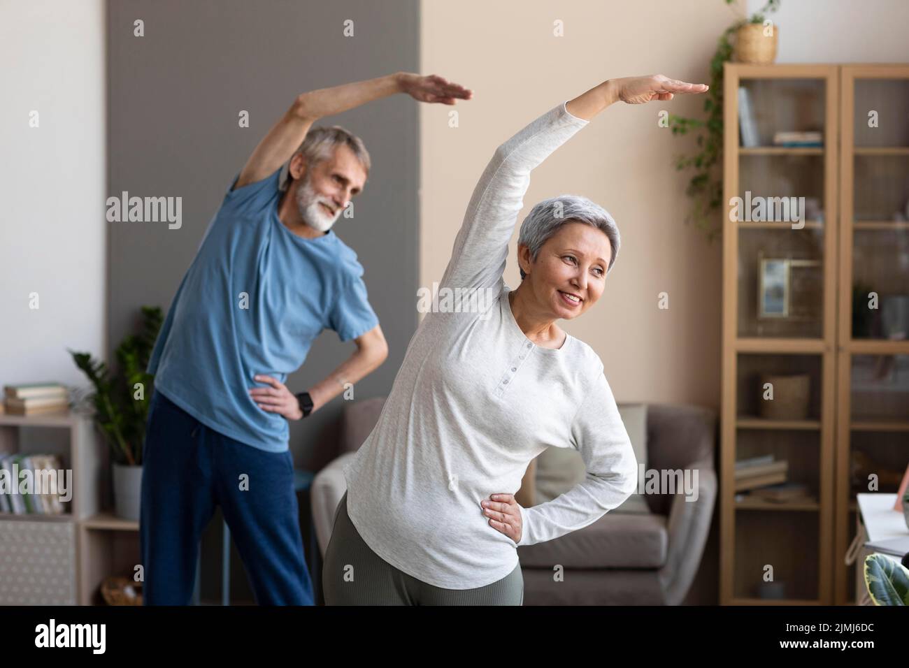 Senior couple exercising home Stock Photo
