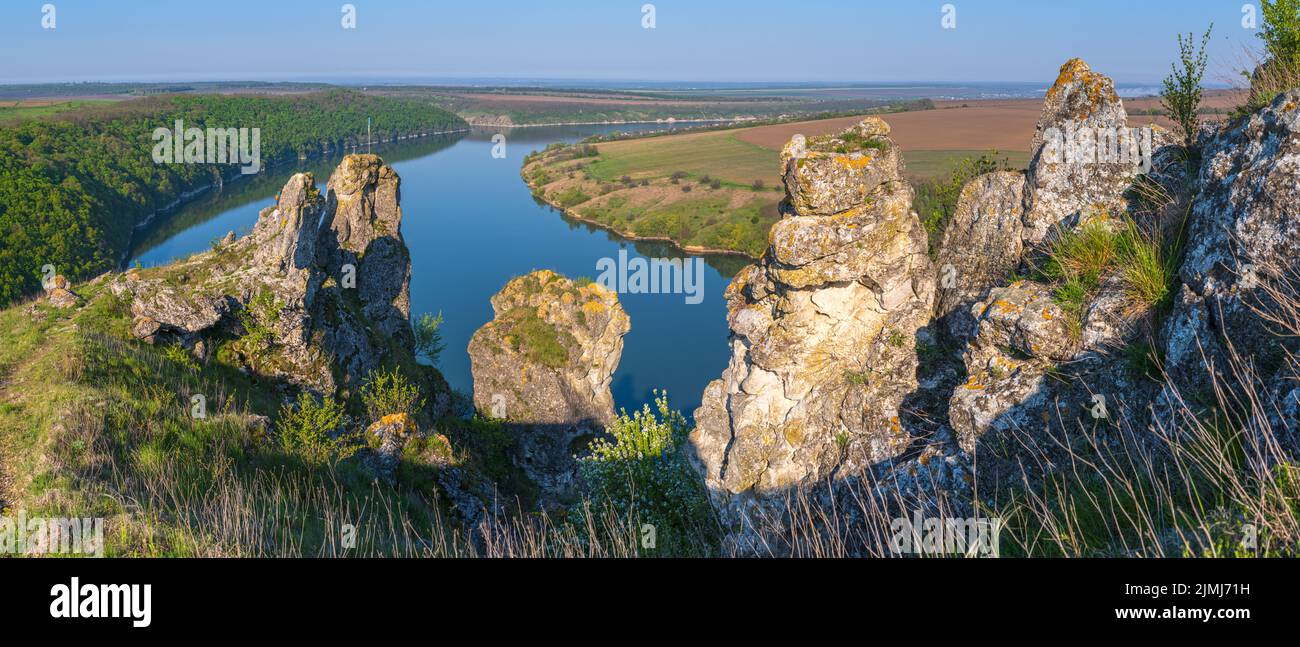Ukraine without Russian Aggression. Amazing spring view on the Dnister River Canyon with picturesque rocks, fields, flowers. Thi Stock Photo