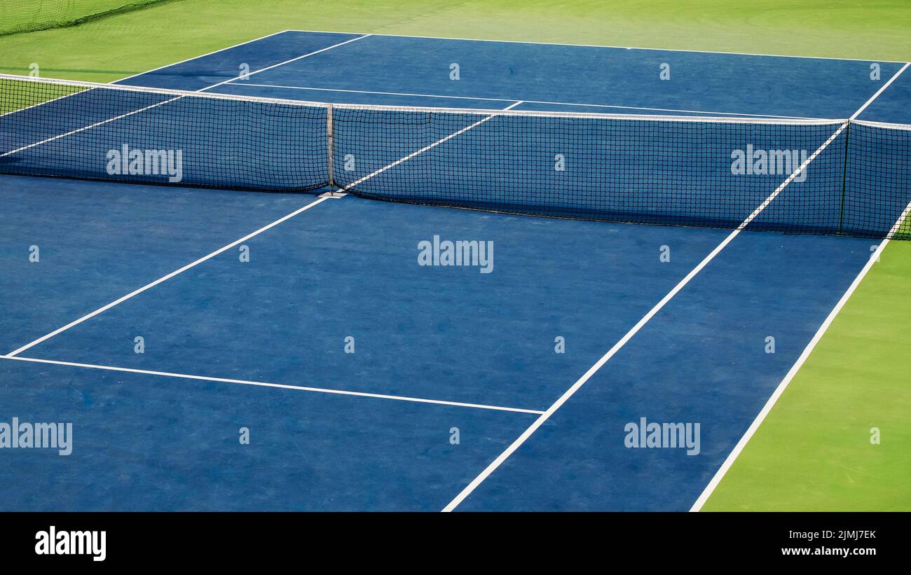 Tennis court diagonal view. Blue and green colors. Sport arena Stock Photo