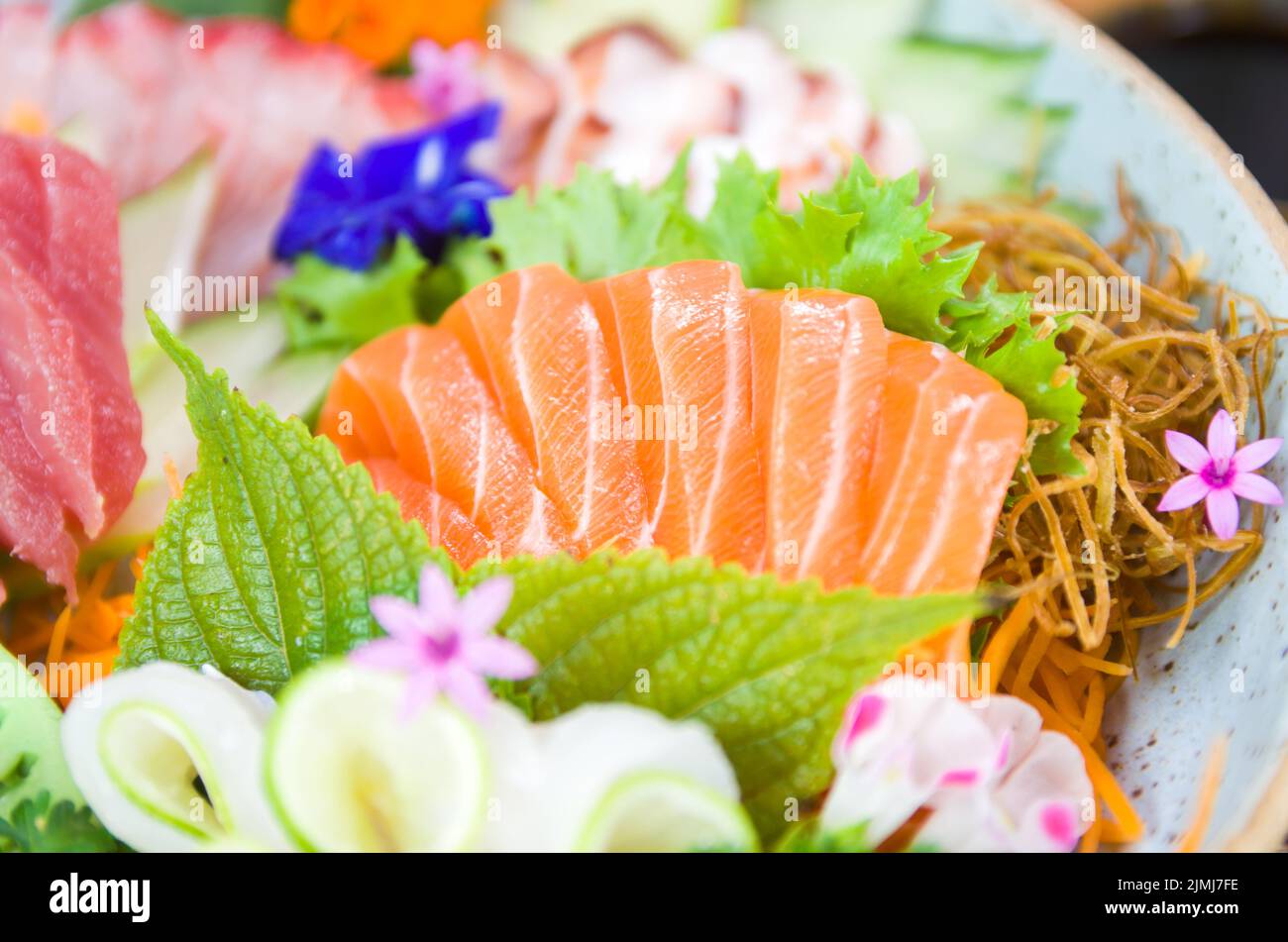 Platter decorated with different flavors of elegant sushi. Stock Photo