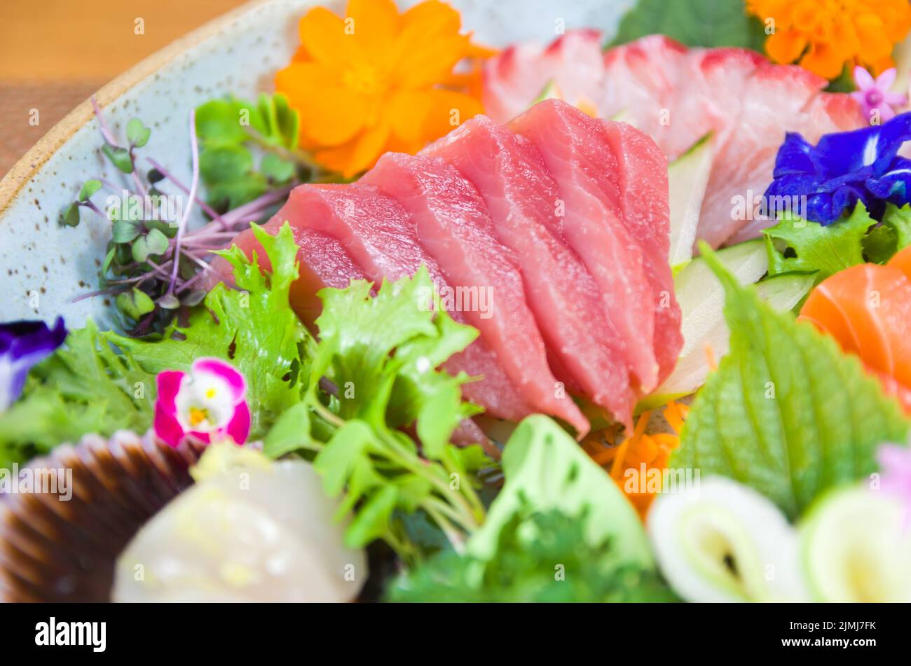 Platter decorated with different flavors of elegant sushi. Stock Photo
