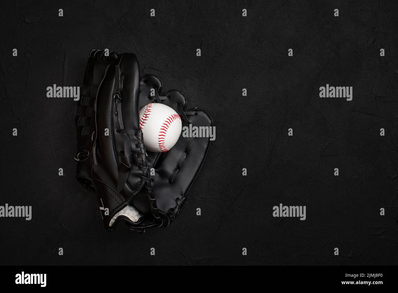Flat lay glove with ball inside Stock Photo