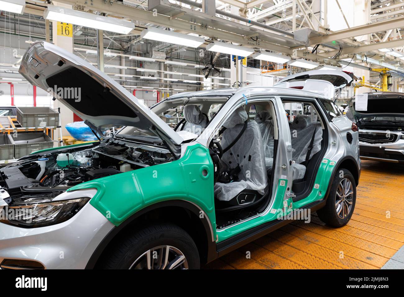 Photo of automobile production line. Welding car bodies. Modern car