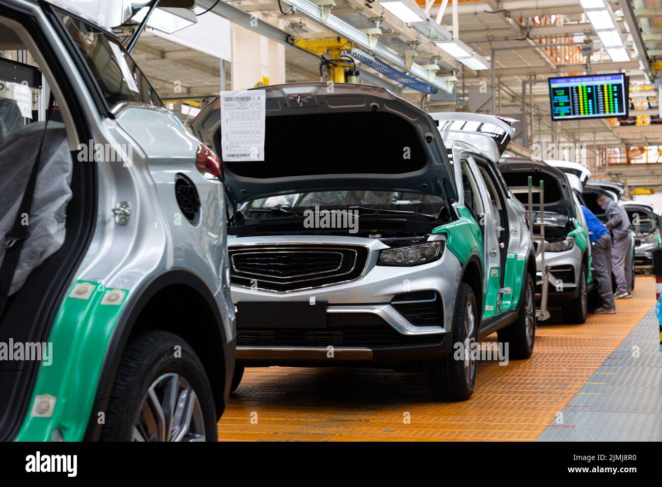 Photo of automobile production line. Welding car bodies. Modern car