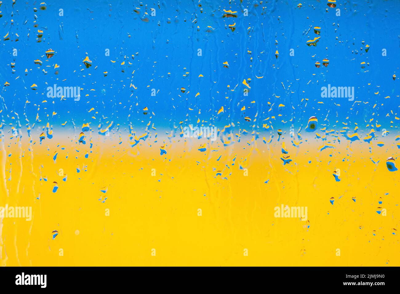 Flag of Ukraine. Abstraction. Raindrops on glass. Bright blue and yellow colors Stock Photo