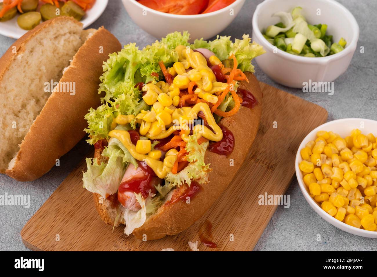 High angle hot dog with salad corn Stock Photo Alamy