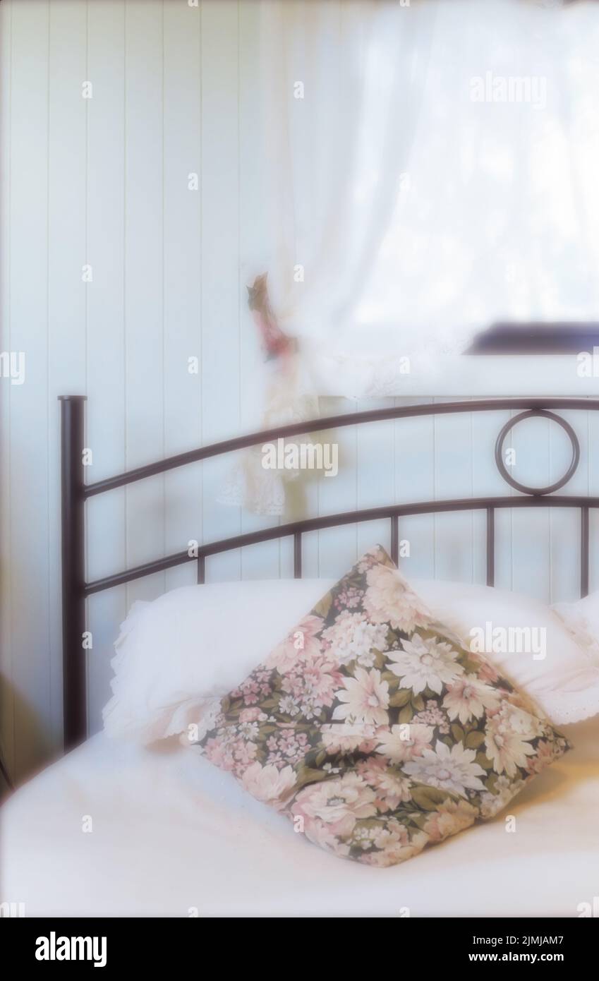 Pillows on bed in white bedroom Stock Photo