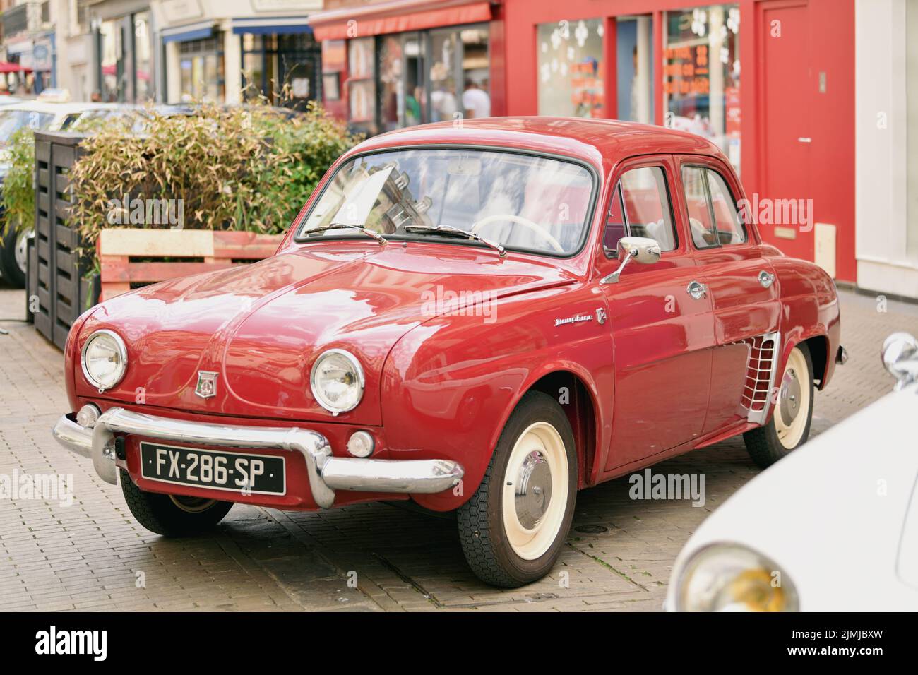 PARIS, FRANCE - MAY, 15, 2022:Vintage red Renault Dauphine Stock Photo