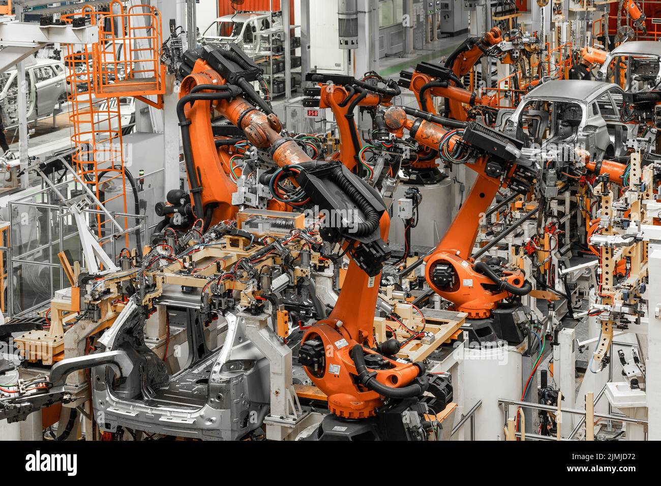 Photo of automobile production line. Modern car assembly plant. Modern