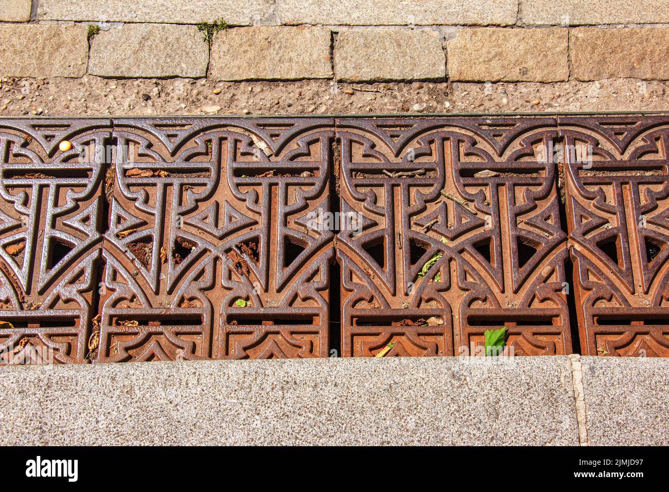 Close-up iron grate drainage system for draining rainwater in Slovakia. Stock Photo