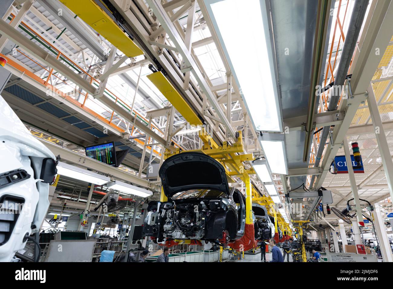 Minsk, Belarus - Dec 15, 2021: Car bodies are on assembly line. Factory for production of cars. Modern automotive industry. A ca Stock Photo