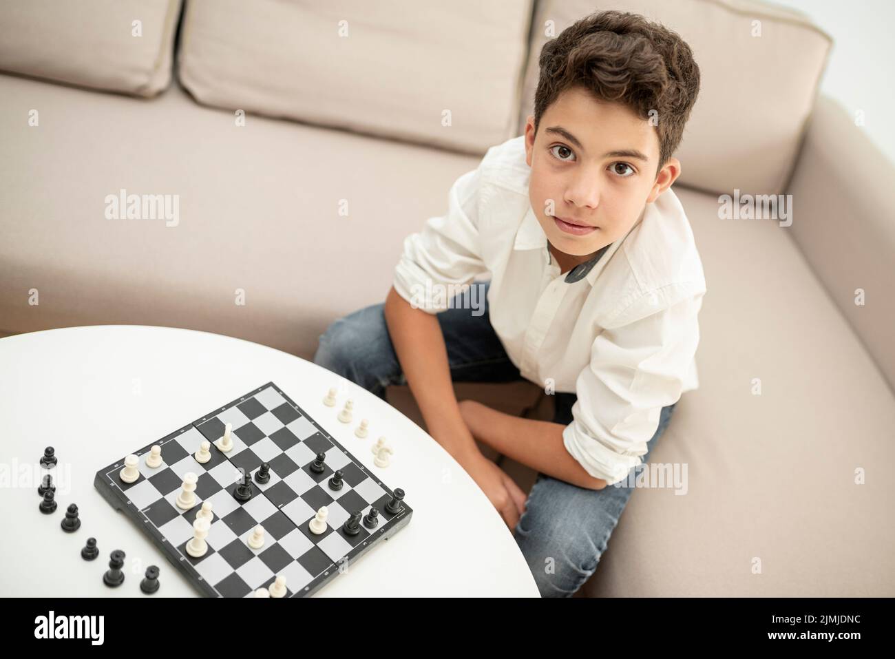 High angle child looking camera Stock Photo